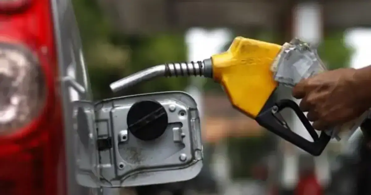 An image of a person fueling a car