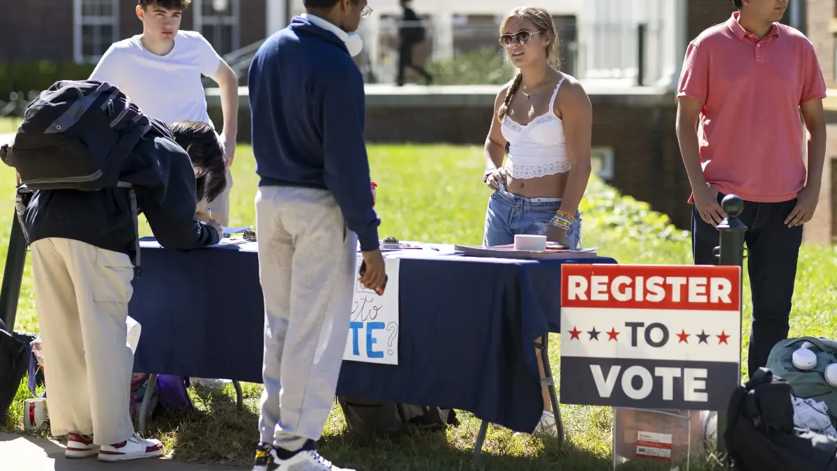 Students at the University of Virginia help eligible voters register to vote in Charlottesville, Va., in 2024.