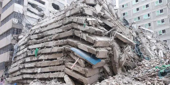 Youth scramble for scrap metal amid Eastleigh building collapse rescue efforts