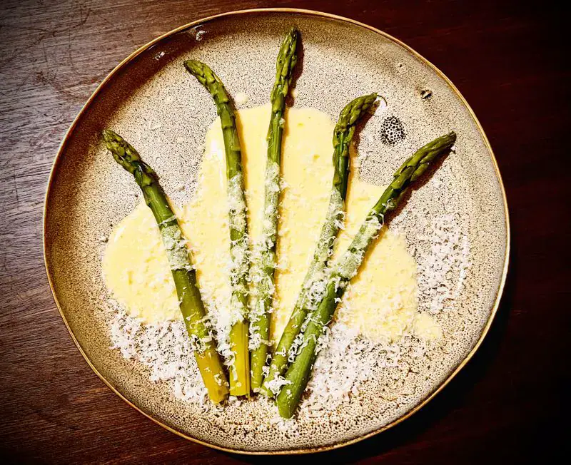 Asparagus spears with rosemary-infused Parmesan butter cream