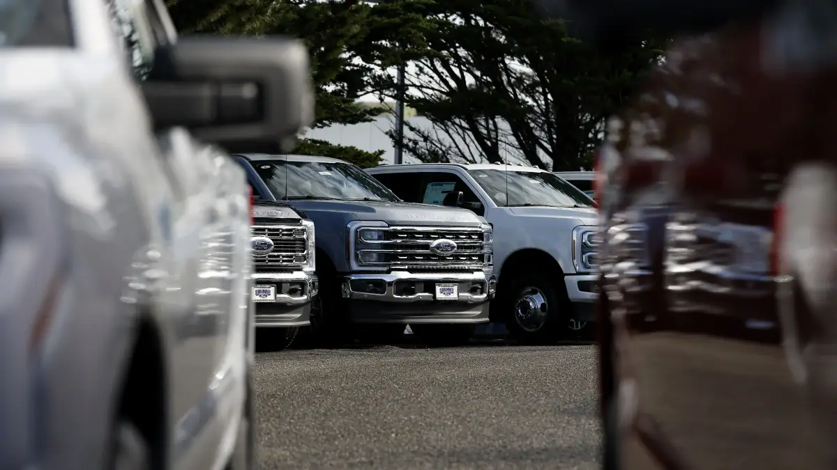 COLMA, CALIFORNIA - JANUARY 06: Ford pickup trucks are displayed on the sales lot at Serramonte Ford on January 06, 2026 in Colma, California.
