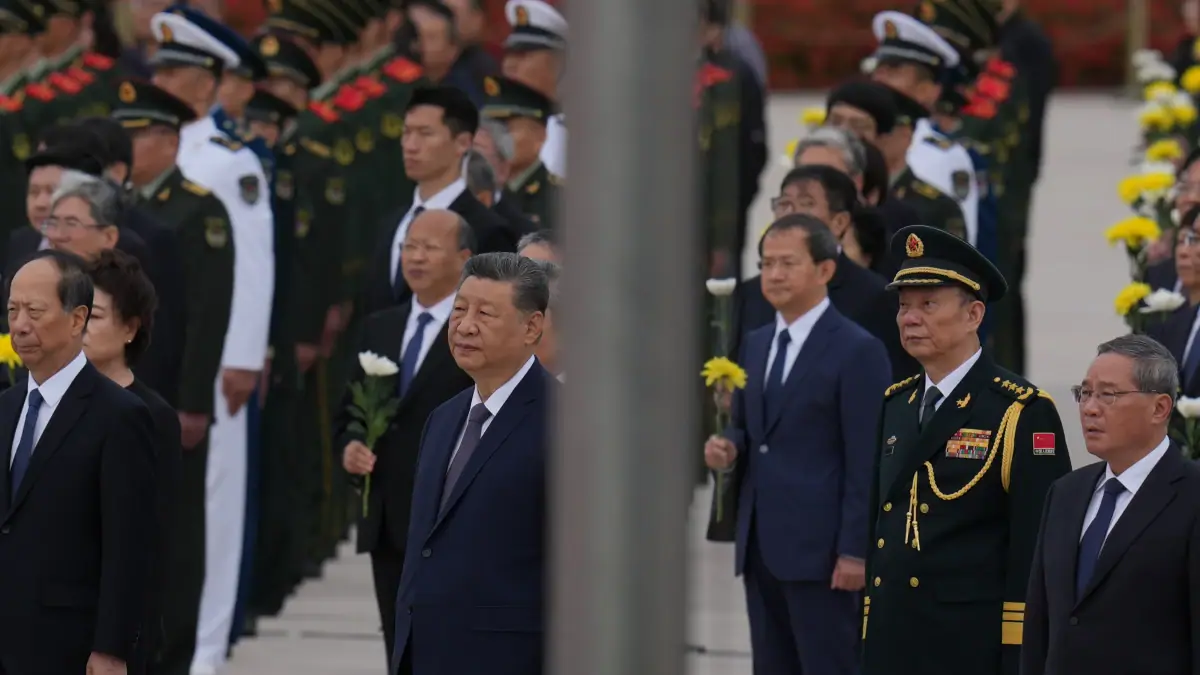Chinese President Xi Jinping, center left and Zhang Shengmin, Vice Chairman of the Central Military Commission second from right attend a ceremony in honor of fallen national heroes at the Monument to the People's Heroes to mark Martyrs' Day at Tiananmen Square in Beijing, Wednesday, Sept. 30, 2026.