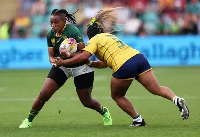 Yonela Ngxingolo is tackled by Tais Gomes da Costa Prioste, of Brazil, during their women's rugby match in England earlier this year
