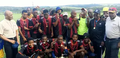 Achievers FC receiving their winners' trophy from tournament sponsor Vuyo Zambodla, right, and ex-Border Football president and Buffalo City Football Region Advisory Council chair Zola Dunywa, left. SUPPLIED
