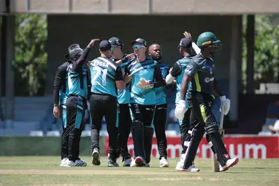 Iinyathi's Sithembile Langa celebrates the wicket of Warriors' Modiri Litheko with teammates at Buffalo Park on Saturday.