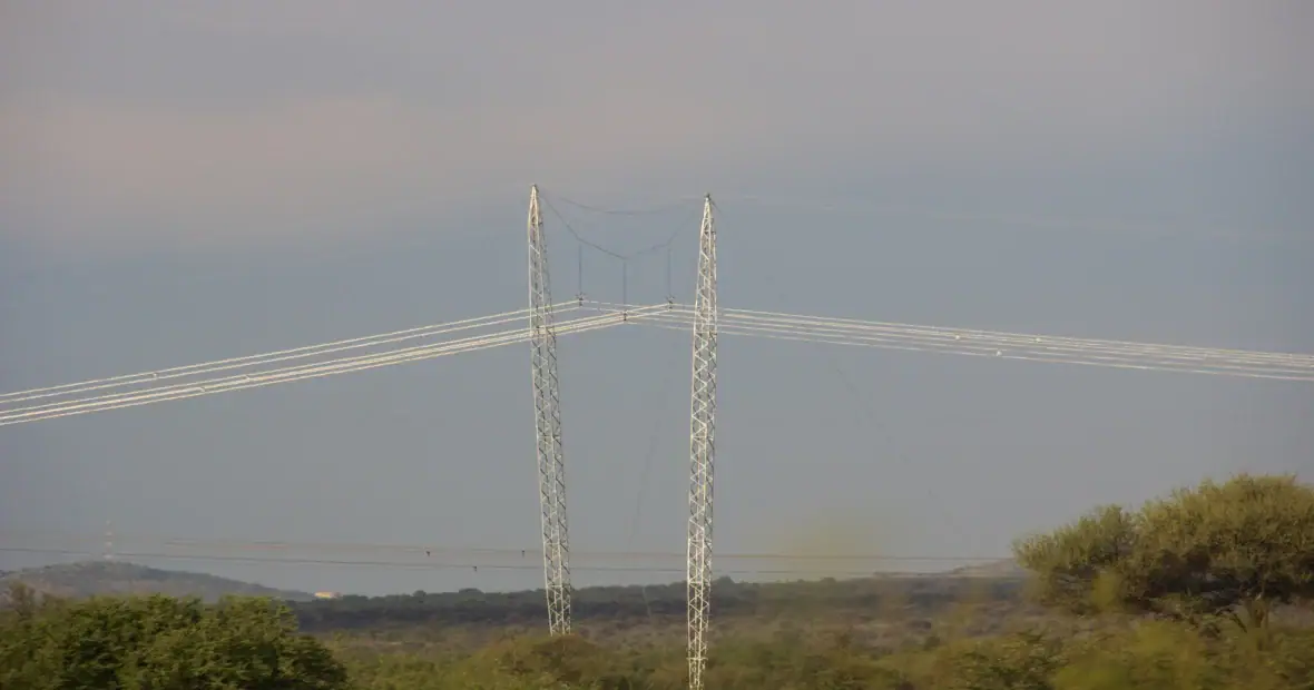 Electricity pylons and overhead power lines crossing a rural South African landscape