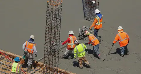 Workers pour cement at a construction site. The International Trade Administration Commission of South Africa has found prima facie evidence that cement imported from Vietnam and Mozambique is being dumped on the local market. Picture: