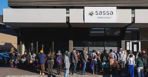 People queue outside a Sassa office.