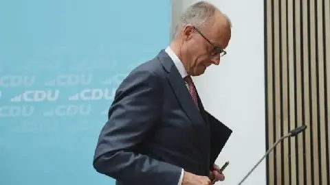 German Chancellor Vows to Lead Amid Historic Defeat