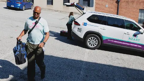 Rob Crisp, a peer support specialist with the Holistic Empathetic Assistance Response Team (HEART) program, responds to a call for a wellness check at a parking lot in Durham, N.C., on Sept. 14.