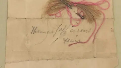 A clipping of hair labeled as Thomas Jefferson's in the collections of the Thomas Jefferson Foundation at Monticello, his primary home and plantation.