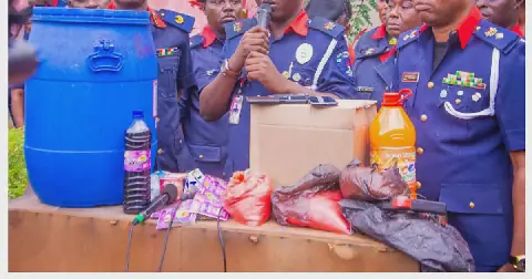 Operatives of the Lagos State Command of the NSCDC display cartons of counterfeit Barkas Juice recovered during a raid in Badagry