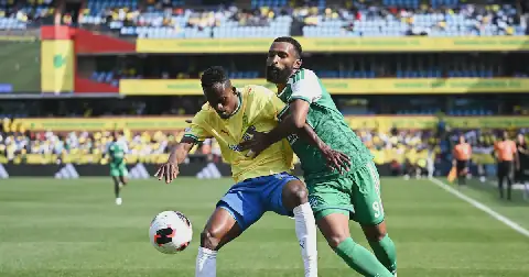 Thabang Matuludi of Mamelodi Sundowns is challenged by Feras Albrikan of Al-Ahli Saudi in their 2026 Fifa African-Asian Pacific Cup match at Loftus Versfeld Stadium in Pretoria on Saturday.