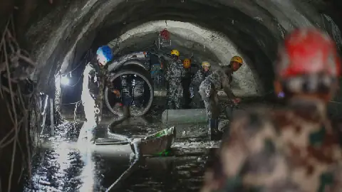 The Nepali Army conducts a search-and-rescue operation on Sept. 10 inside the Chilime Hydropower Station tunnel days after the deadly flash floods and mudslides in Nepal's Rasuwa district in August. In the wake of the disaster, concerns are being raised about the impact of the construction of hydropower plants and dams in the Himalayas.