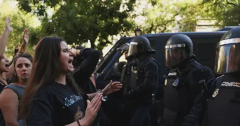 Spanish riot police block housing activists trying to prevent the eviction of Maricarmen Abascal, 87, in Madrid, Spain, on September 23 2026. Picture: