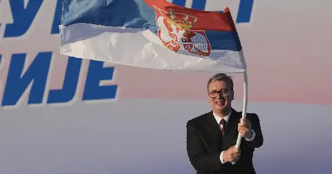 Serbian President Aleksandar Vucic waves a Serbian flag during a rally of the ruling Serbian Progressive Party in Belgrade, Serbia, on June 27 2026. Picture: