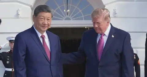 President Donald Trump, right, greets China's President Xi Jinping on the South Portico of the White House, on September 24 2026, in Washington. Picture: