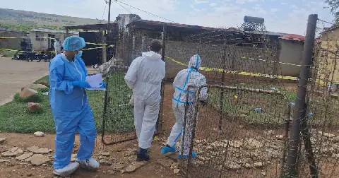Forensic police investigators in the Dora's tavern. Authorities have said 17 people were killed yesterday by unknown people in Wedala in the West Rand, Gauteng.
