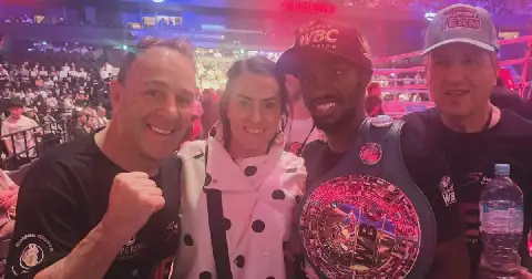 A victorious Ricardo Malajika poses with his new WBC super-flyweight title with, from left, manager Brian Mitchell, Mitchell's wife, Sharleen, and trainer Manny Fernandes. Picture: