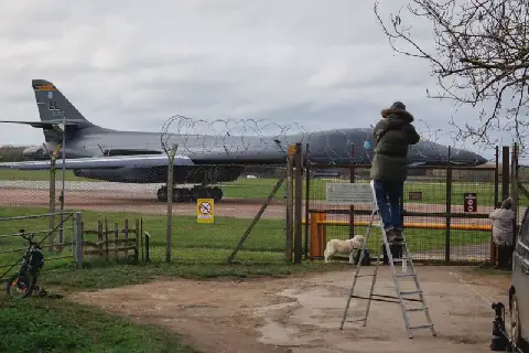 UK counter-terror police question five men held at airbase used by US to attack Iran
