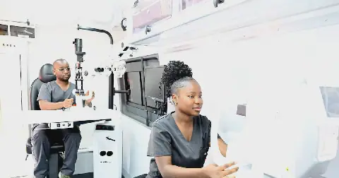 UJ optometry students test the equipment inside the mobile clinic.
