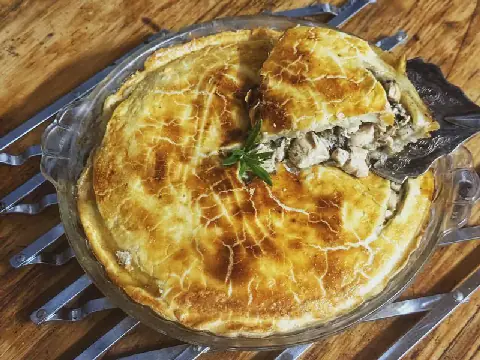 A family-size chicken and mushroom pie