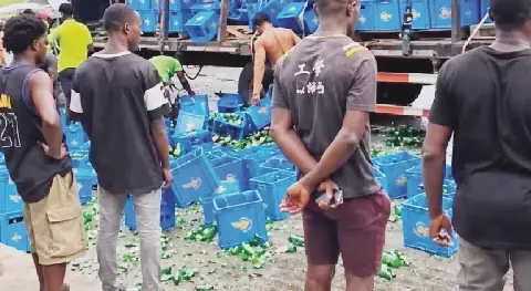 LASTMA stops commuters from drinking spilled beer after crash
