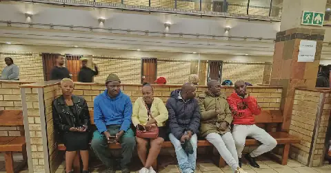 The family of Ntombifuthi Nxumalo, whose body was discovered next to Mooifontein cemetery in Ekurhuleni, waiting for the suspect's first court appearance. Picture: Seipati Mothoa