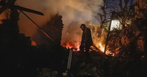 A Ukrainian serviceman, Oleh, looks for his wife, Yevheniia, and her mother at the site of their private house hit by a Russian drone strike, amid Russia's attack on Ukraine, in Kyiv, Ukraine, on September 30 2026. Picture: Reuters/Gleb Garanich