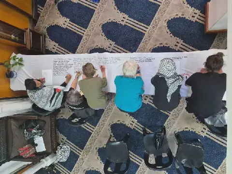 Cape Town Community Writes Names of Palestinian Children Killed in Gaza on 20-Metre Shroud