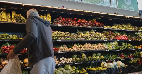 A customer shops for produce in an H-E-B grocery store in Austin, Texas, on May 11.