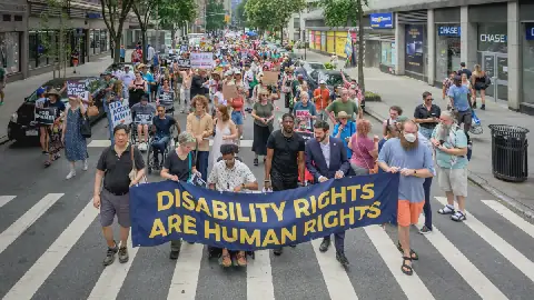 Hundreds of disability advocates gathered in New York in 2025 to protest cuts to Medicaid and demand the enforcement of disability rights protections.