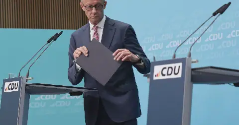 German Chancellor and leader of Germany's center-right Christian Democratic Union Friedrich Merz leaves after a press conference one day after state elections in Berlin and Mecklenburg-Western Pomerania, at the CDU's headquarters in Berlin on Sept. 21.