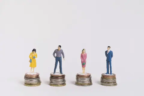 business-man-woman-sitting-equal-piles-coins