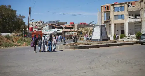 A group of students walk along a street in the city of Shahba, Sweida province, Syria, on September, 26, 2026. REUTERS/Kinan hlal
