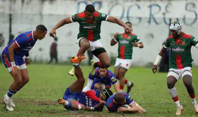 Gardens centre Duwayne Prince jumps over a cluster of Saldanha players during a tense second round Gold Cup rugby clash at the Central Field in Kariega on Saturday