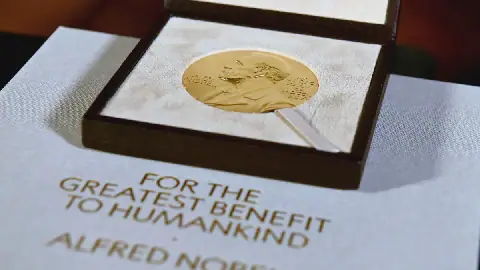 FILE - A Nobel diploma and medal are displayed, Dec. 8, 2020, during a ceremony in New York.