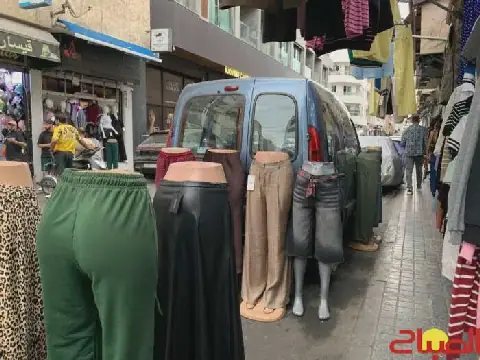 Street Vendors and Parked Cars Congest Sidewalks in Casablanca's Maarif District