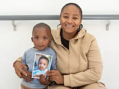 Rorisang Tolomane (3) and his delighted mother, Lebone, show the difference that Operation Smile makes in delivering free surgical interventions for children born with cleft conditions. The public can support the organisation’s fundraising efforts by collecting and donating their used plastic bottle tops, which are recycled for use in Tuffy’s black refuse bags.