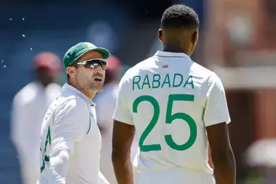 Former SA captain Dean Elgar talks with Kagiso Rabada