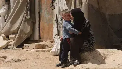 A mother embraces her son in Gaza. Image: Supplied