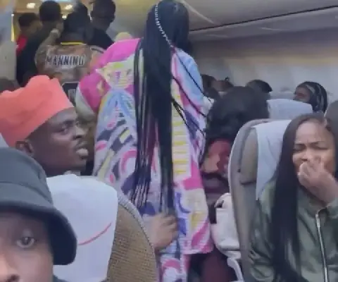 Mid-air drama as man attempts to open plane’s emergency exit