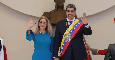 Venezuelan President Nicolas Maduro and his wife Cilia Flores wave after his swearing-in ceremony for a third term at the National Assembly in Caracas, Venezuela, on Jan. 10, 2025.