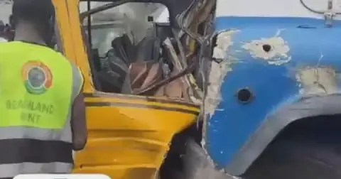 Four injured as container truck crashes into vehicles