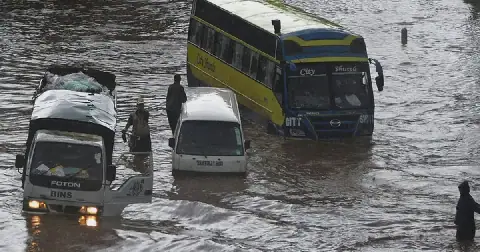 Vehicles partially submerged in floodwater following heavy rains in Nairobi, Kenya
