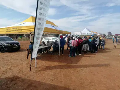 Aid: Citizens queing to apply for social grants in Taung. Photo: Sassa