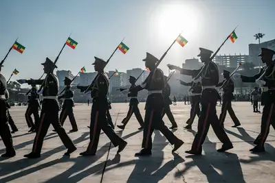Members of a military music band march during a rally in Addis Ababa, Ethiopia, on November 7, 2021, in support of the national defence forces. Five days after the government declared a state of emergency throughout the country, tens of thousands of Ethiopians vowed at a pro-government rally in Addis Ababa on November 7 to defend the capital against Tigrayan rebels and denounced diplomatic efforts to end the conflict in the north of the country. (Photo by Eduardo Soteras/AFP)