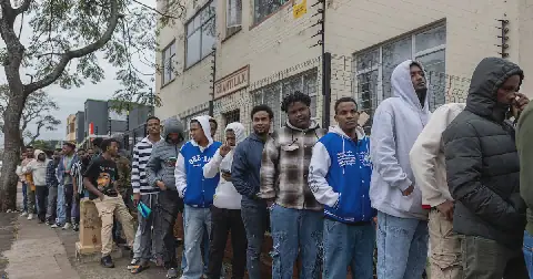 People queue outside the Department of Home Affairs offices on Che Guevara Road in Durban. Photo: SANDILE NDLOVU