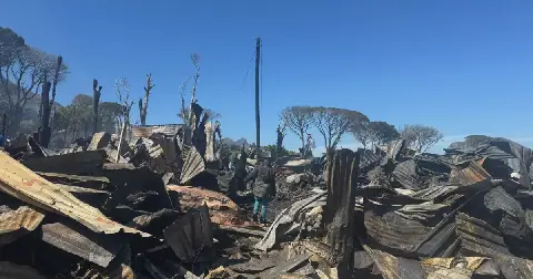 Imizamo Yethu residents pick up the pieces after fire destroys shacks