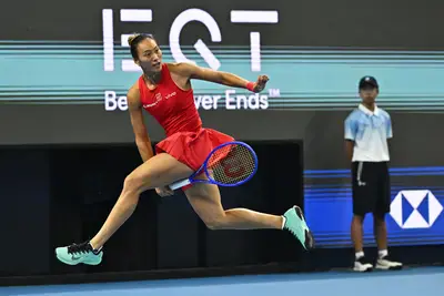 China's Zheng Qinwen returns to Russia's Mirra Andreeva during their final at the China Open in Beijing on Sunday